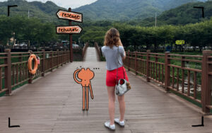 person standing at a crossroads path looking forward